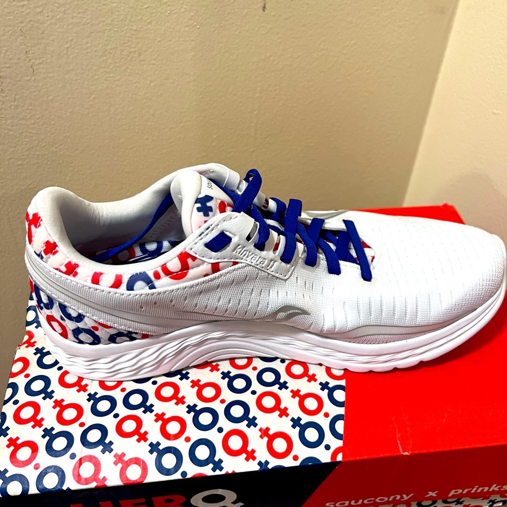 Saucing red white and blue sneakers